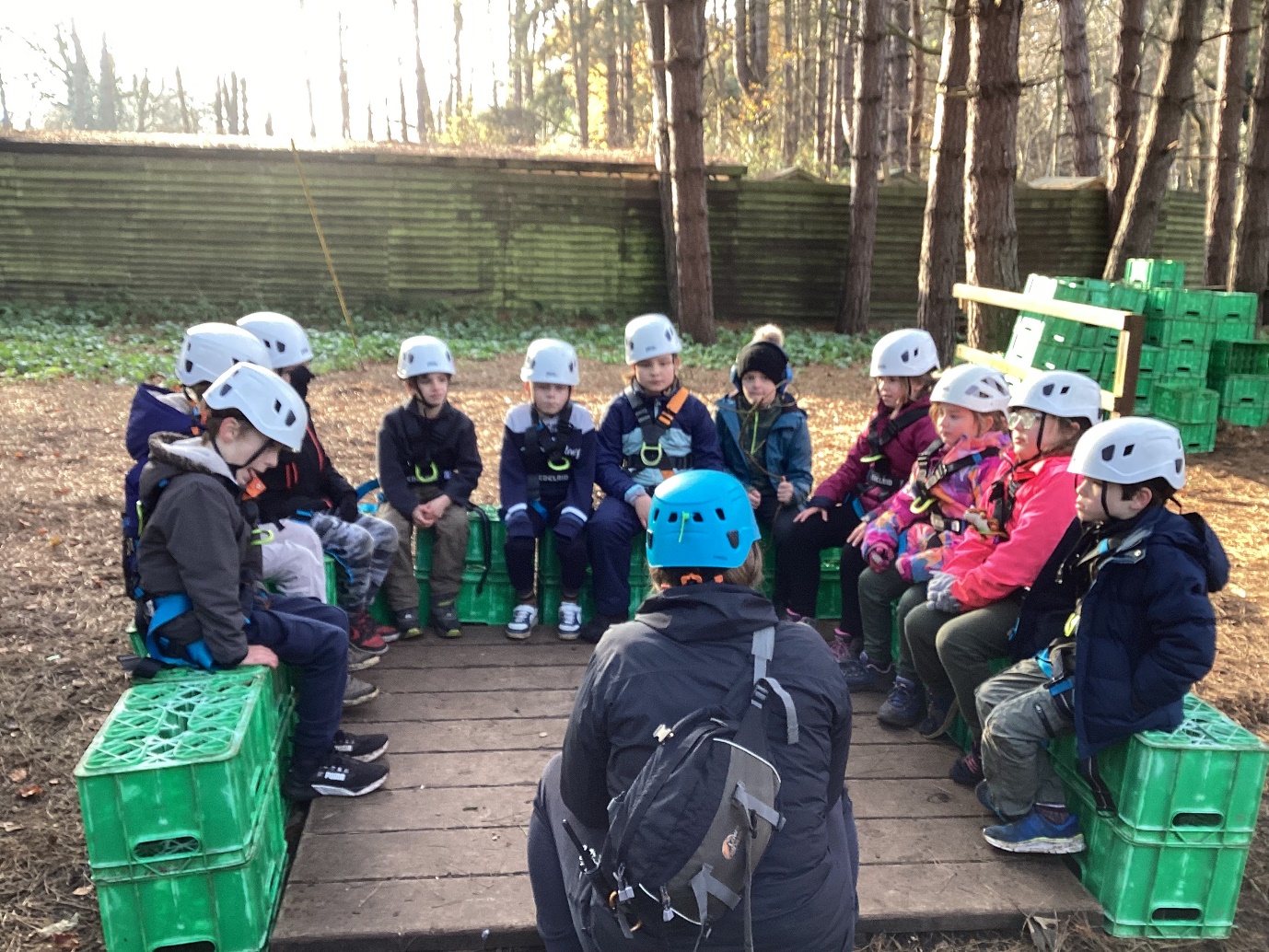 A group of people wearing helmets

Description automatically generated